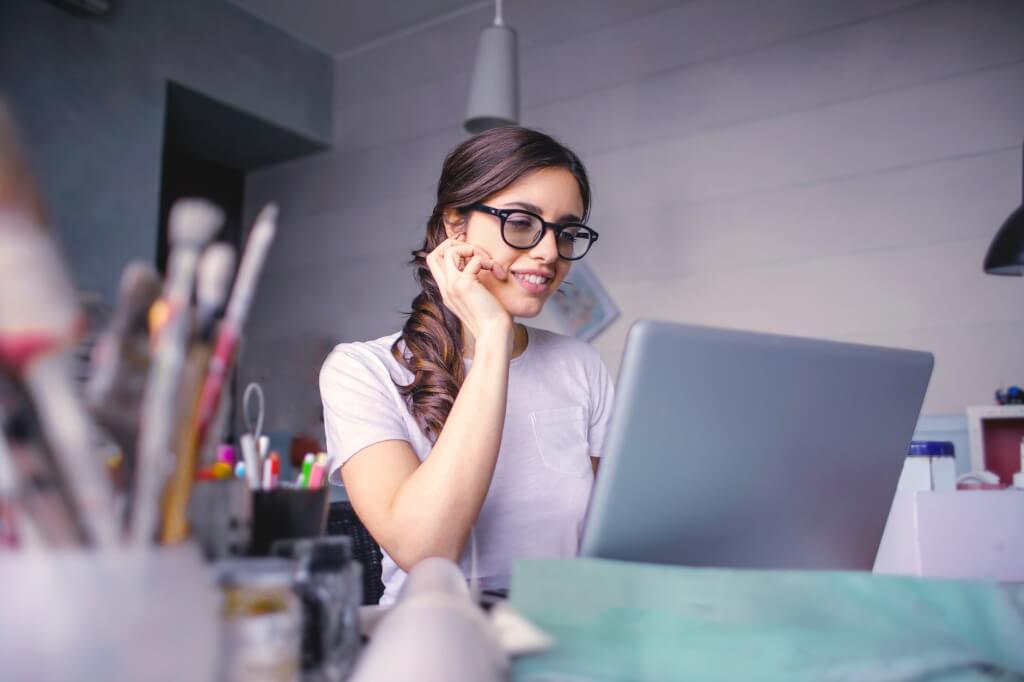 woman in white t shirt wearing black framed eyeglasses